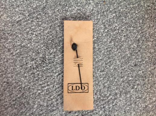 Black Wound Badge Stickpin on Original LDO Card Stock.